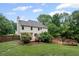 Landscaped backyard with a wooden deck and a privacy fence at 125 Winter Valley Ct, Fayetteville, GA 30215