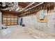 Unfinished basement with garage door and open layout, perfect for storage or customization at 125 Winter Valley Ct, Fayetteville, GA 30215
