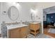 Bright bathroom features double vanities, patterned tile floors, and white wainscotting at 125 Winter Valley Ct, Fayetteville, GA 30215