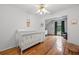 Bright Bedroom features hardwood floors, a white crib, and lots of natural light at 125 Winter Valley Ct, Fayetteville, GA 30215
