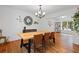 Bright dining room featuring hardwood floors and a view of the well manicured backyard at 125 Winter Valley Ct, Fayetteville, GA 30215