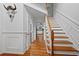 Bright foyer with hardwood floors, a staircase, and decorative trim at 125 Winter Valley Ct, Fayetteville, GA 30215