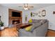 Cozy living room with brick fireplace and hardwood floors at 125 Winter Valley Ct, Fayetteville, GA 30215