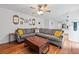 Spacious living room with hardwood floors and view into eat-in kitchen at 125 Winter Valley Ct, Fayetteville, GA 30215