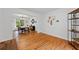 Spacious open-concept space featuring hardwood floors, neutral paint palette, and many windows at 125 Winter Valley Ct, Fayetteville, GA 30215