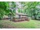 Backyard view showcasing a deck and surrounding trees, offering a serene outdoor space at 1715 Lee St, Decatur, GA 30035