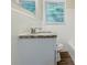 Bathroom featuring a vanity with granite countertop, toilet, and tiled shower at 1715 Lee St, Decatur, GA 30035