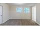 Cozy bedroom with neutral paint, plush carpet, and two windows offering natural light at 1715 Lee St, Decatur, GA 30035