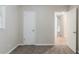 Bedroom showcasing neutral walls and carpet, with an open door and a closet at 1715 Lee St, Decatur, GA 30035