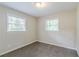 Neutral bedroom with carpeted floors and two windows providing natural light at 1715 Lee St, Decatur, GA 30035