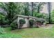 Inviting exterior of a house with a well-maintained lawn and neatly trimmed bushes at 1715 Lee St, Decatur, GA 30035