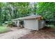 Side angle of home with a light neutral exterior and driveway at 1715 Lee St, Decatur, GA 30035