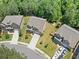 Aerial view showing a street, two story homes with manicured lawns and a dense tree line at 178 Crestbrook Way, Dallas, GA 30157