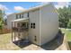 Backyard with raised deck of a home with neutral colored siding at 178 Crestbrook Way, Dallas, GA 30157