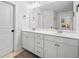 Bathroom featuring double sink vanity with white countertops and shaker cabinets at 178 Crestbrook Way, Dallas, GA 30157