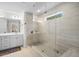 Bright bathroom showcasing a glass shower with a rain shower head and a double sink vanity at 178 Crestbrook Way, Dallas, GA 30157