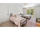 Bright bedroom with two twin beds, plush carpet, and natural light from a large window at 178 Crestbrook Way, Dallas, GA 30157