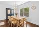 Bright dining area with large window and stylish light fixture at 178 Crestbrook Way, Dallas, GA 30157