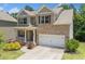 Attractive two-story brick home with a well-manicured lawn and an attached two-car garage at 178 Crestbrook Way, Dallas, GA 30157