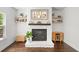 Cozy living room with a stone fireplace and floating shelves at 178 Crestbrook Way, Dallas, GA 30157
