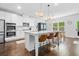 Spacious kitchen with granite countertops, stainless steel appliances, white cabinets and island with seating at 178 Crestbrook Way, Dallas, GA 30157