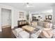 Inviting living room open to the kitchen with hardwood floors and lots of natural light at 178 Crestbrook Way, Dallas, GA 30157