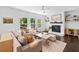 Spacious living room featuring a fireplace and an adjacent deck at 178 Crestbrook Way, Dallas, GA 30157