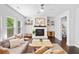 Spacious living room with fireplace, lots of natural light, and ample seating at 178 Crestbrook Way, Dallas, GA 30157