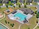 Aerial view of community pool and playground featuring ample seating and kid-friendly water slides at 178 Crestbrook Way, Dallas, GA 30157