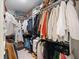 Well-organized walk-in closet with ample hanging space and shelving for shoes, clothing, and accessories at 178 Crestbrook Way, Dallas, GA 30157