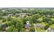 Aerial view showcases the home's location within a wooded neighborhood at 2610 Ginger Dr, Buford, GA 30519