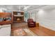 Finished basement featuring a brick fireplace, bunkbeds, and laminate flooring at 2610 Ginger Dr, Buford, GA 30519