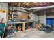 Basement workshop with workbench, pegboard, shelving, and various tools offering ample space for projects at 2610 Ginger Dr, Buford, GA 30519