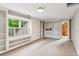 Bonus room with built-in shelving, carpet, light fixture, and window with view of exterior at 2610 Ginger Dr, Buford, GA 30519