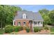 Beautiful home with brick facade, black shutters, and a welcoming front porch at 2610 Ginger Dr, Buford, GA 30519