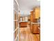 View of a spacious kitchen with wooden cabinets, hardwood floors and granite counters at 2610 Ginger Dr, Buford, GA 30519