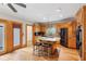 A spacious kitchen with granite counters, hardwood floors, and island with seating at 2610 Ginger Dr, Buford, GA 30519