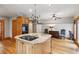 Spacious kitchen features granite counters, wood cabinets, and stainless steel appliances at 2610 Ginger Dr, Buford, GA 30519