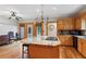 A spacious kitchen with granite counters, hardwood floors, and island with cooktop at 2610 Ginger Dr, Buford, GA 30519