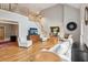 Expansive living room with hardwood floors, high ceilings, stairs to a second level and an archway to the dining room at 2610 Ginger Dr, Buford, GA 30519