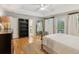 A spacious main bedroom with hardwood floors and balcony access at 2610 Ginger Dr, Buford, GA 30519