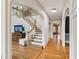 View of the staircase with beautiful wood and white trim, open railing and wood floors leading to second story at 2610 Ginger Dr, Buford, GA 30519