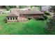 Aerial view of the home featuring a deck, patio area, and spacious backyard for outdoor enjoyment at 3257 Georgian Woods Cir, Decatur, GA 30034
