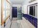 Cozy bathroom showcasing blue tiles, shower, and well-lit mirror at 3257 Georgian Woods Cir, Decatur, GA 30034
