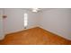 Bedroom features hardwood floors, natural light, and simple, clean design at 3257 Georgian Woods Cir, Decatur, GA 30034