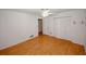 Bright bedroom with hardwood floors, a ceiling fan, and an entry to another room at 3257 Georgian Woods Cir, Decatur, GA 30034