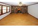 The expansive living room features a striking stone fireplace and beautiful hardwood floors at 3257 Georgian Woods Cir, Decatur, GA 30034