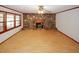 Bright living room with hardwood floors, windows, and a cozy stone fireplace at 3257 Georgian Woods Cir, Decatur, GA 30034
