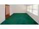 This living room features natural lighting, with unique green carpeting throughout at 3257 Georgian Woods Cir, Decatur, GA 30034