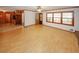 Spacious living room with hardwood floors and trim, flowing into kitchen area with natural light at 3257 Georgian Woods Cir, Decatur, GA 30034